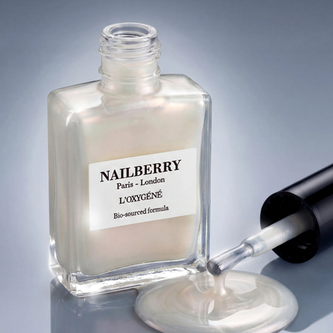 Nail polish bottle with dropper labeled 'Nailberry' on a gray background