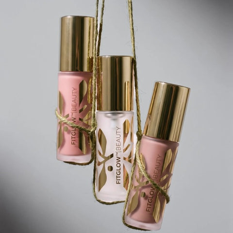 Fitglow Beauty Mini Lip Serums tied with gold ribbon as a gift