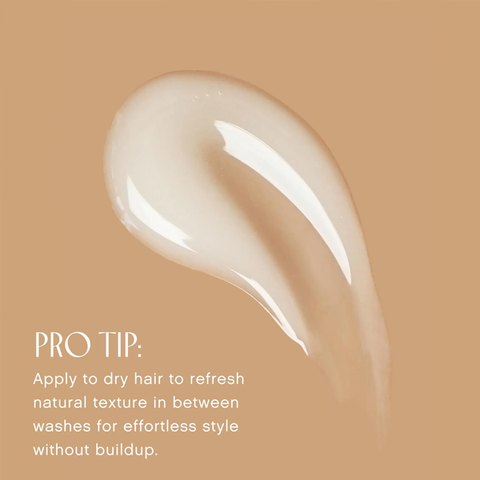Close-up of a white hair product on a beige background with text providing usage tips.